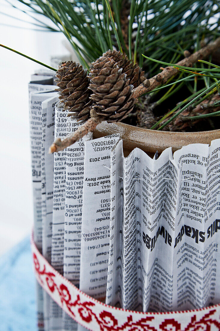 DIY planter decorated with folded newspaper