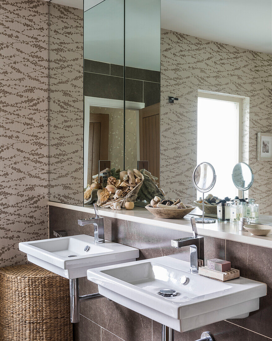 Sticks wallpaper in bathroom with pair of duravit basins and taps
