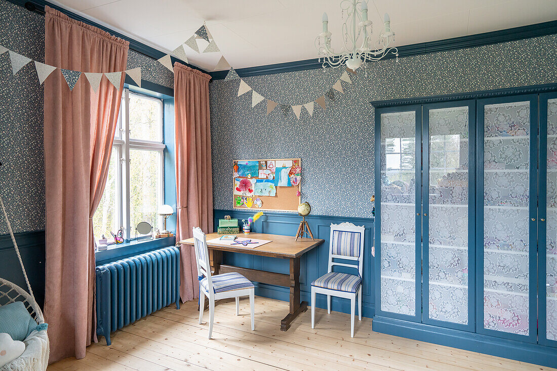 Blue showcase cabinet in the children's room in a vintage style in