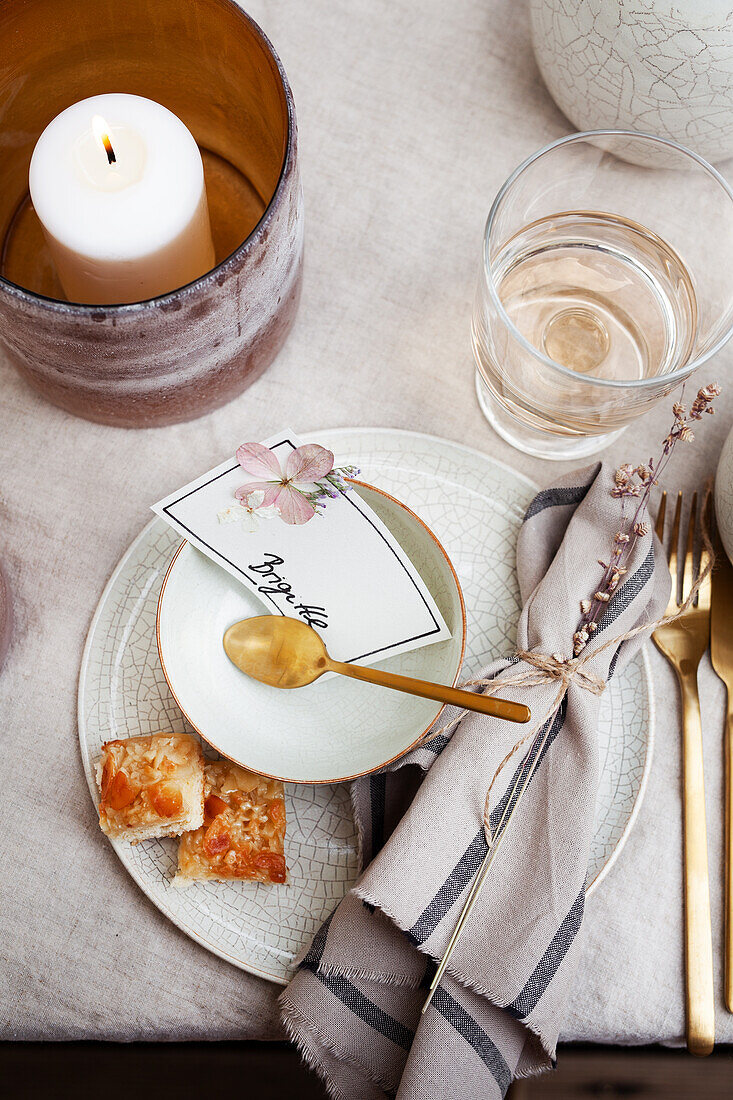 Place setting with hand-made place card and honey cake