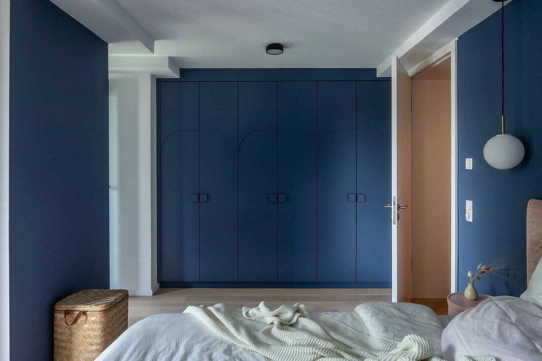 Blue fitted wardrobes in bedroom