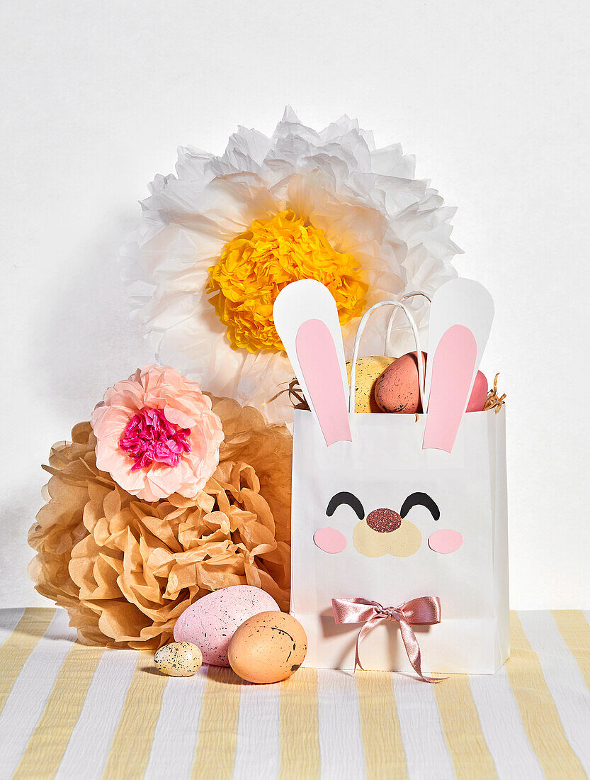 DIY paper bag with Easter eggs and paper flowers