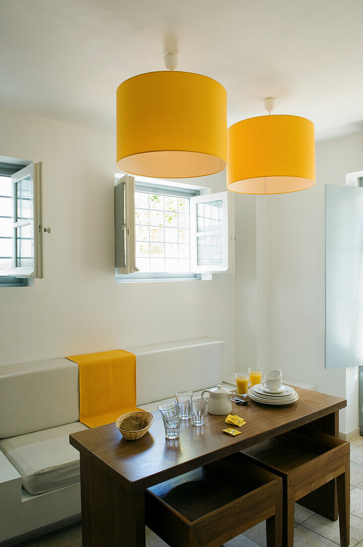 Breakfast nook with yellow accents