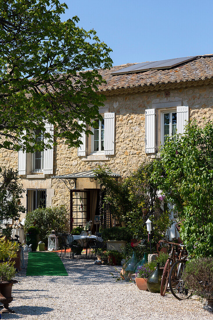 Provençal country house with white shutters, terrace and garden