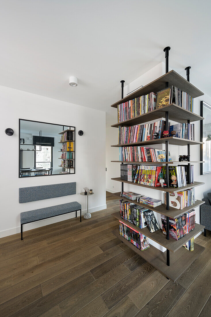 Custom bookshelves with bench and side table under wall-mounted mirror in background