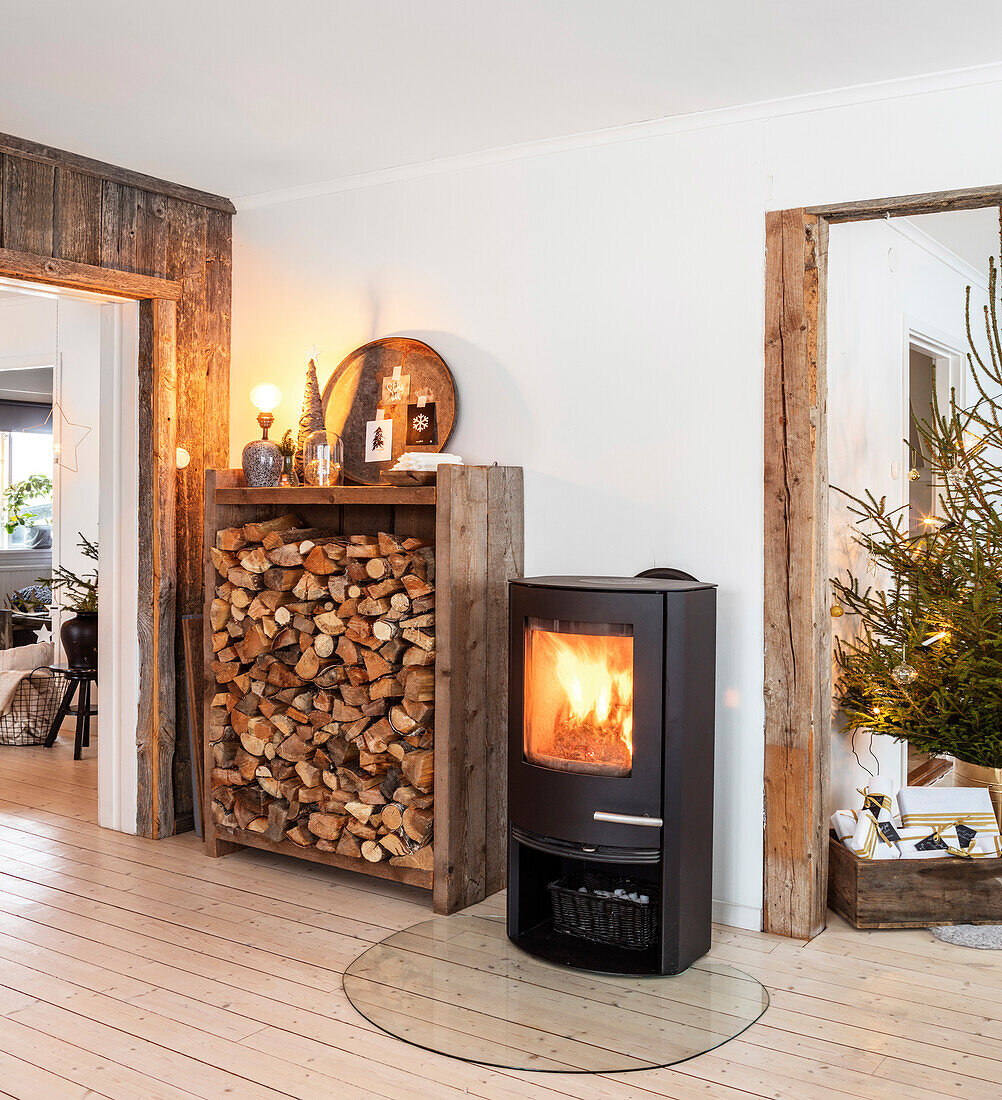 Wood-burning stove with wood in a rustic living room