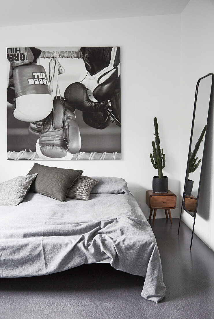 Picture of boxing gloves in a monochrome bedroom