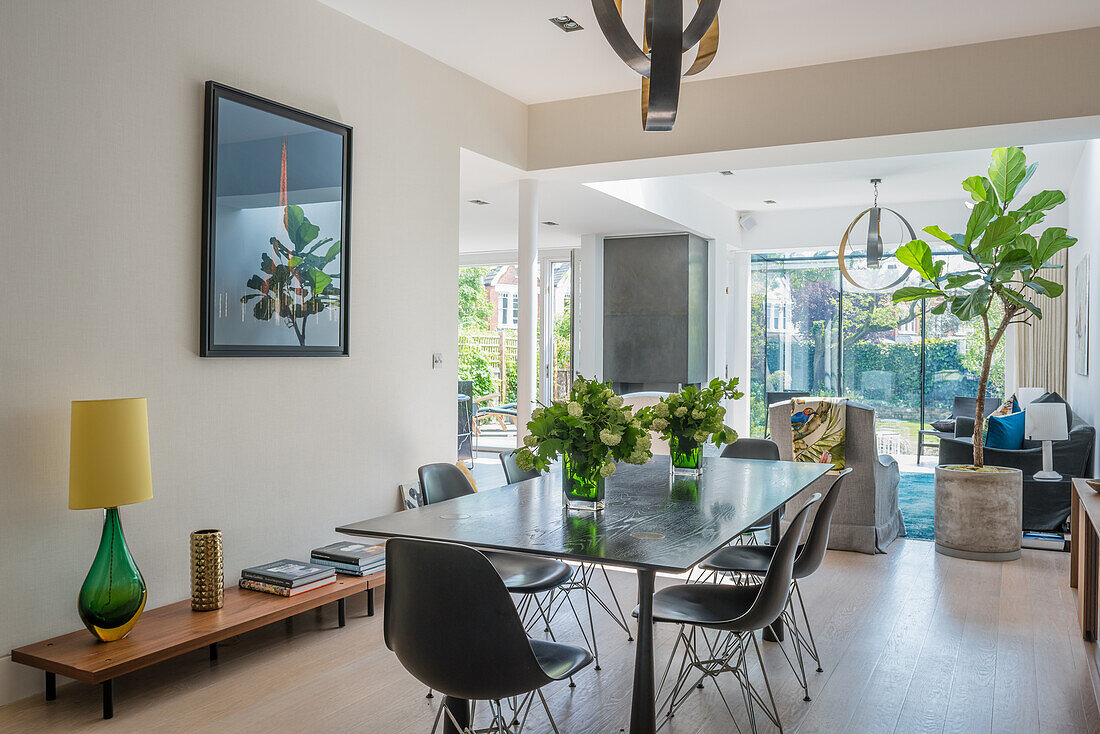 Modern dining room with large table and black chairs