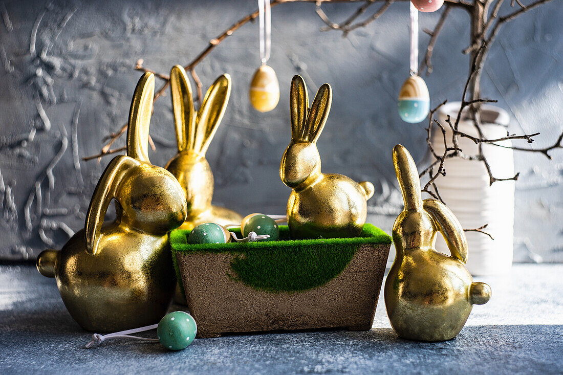 Place setting for festive Easter dinner using with golden bunnies