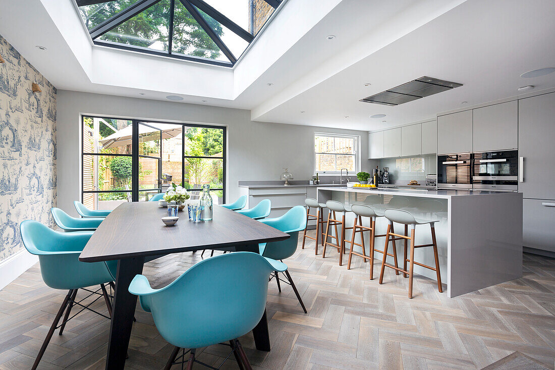 Modern kitchen with dining area and glass ceiling