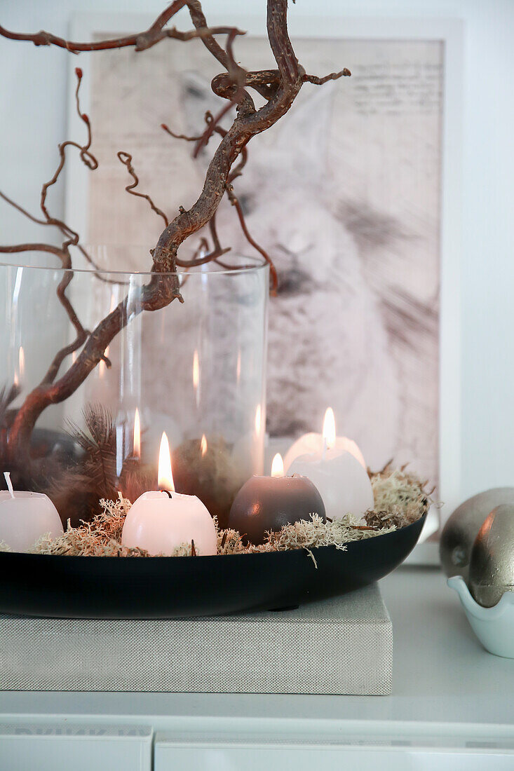 Candle arrangement with branches and moss, picture with bunny