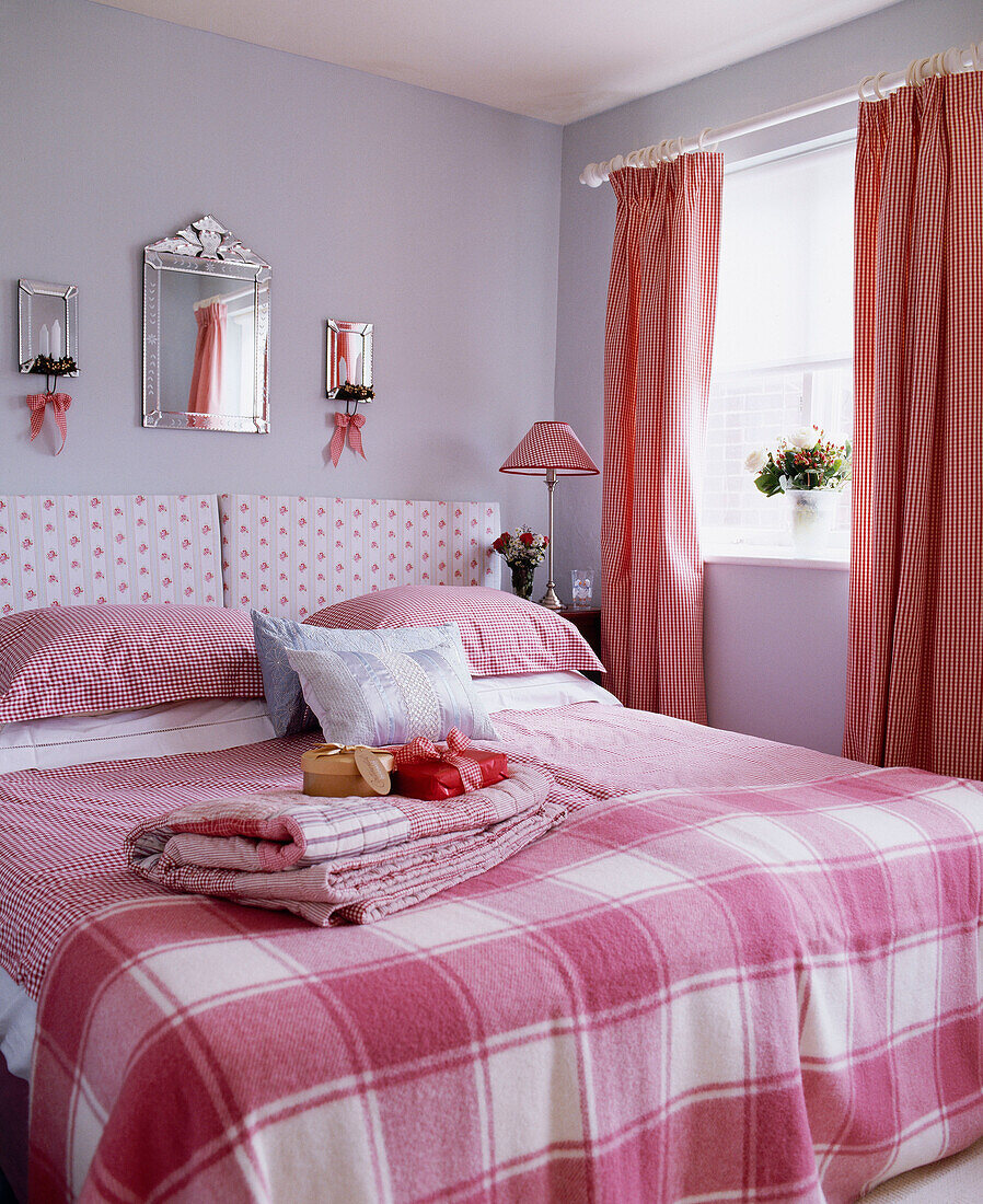 Bedroom with gingham pattern covers on the bed