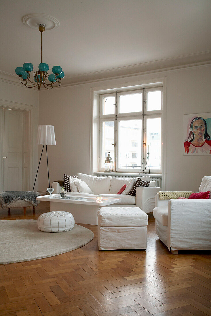 White upholstered furniture in 20th century Stockholm apartment living room