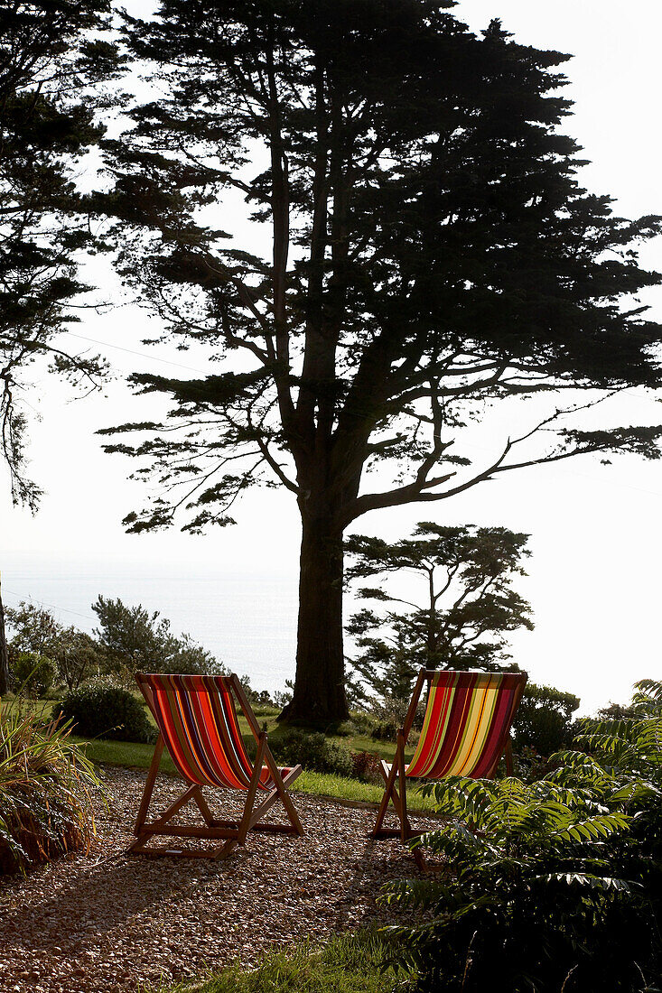 Striped deckchairs in grounds of Devon country home