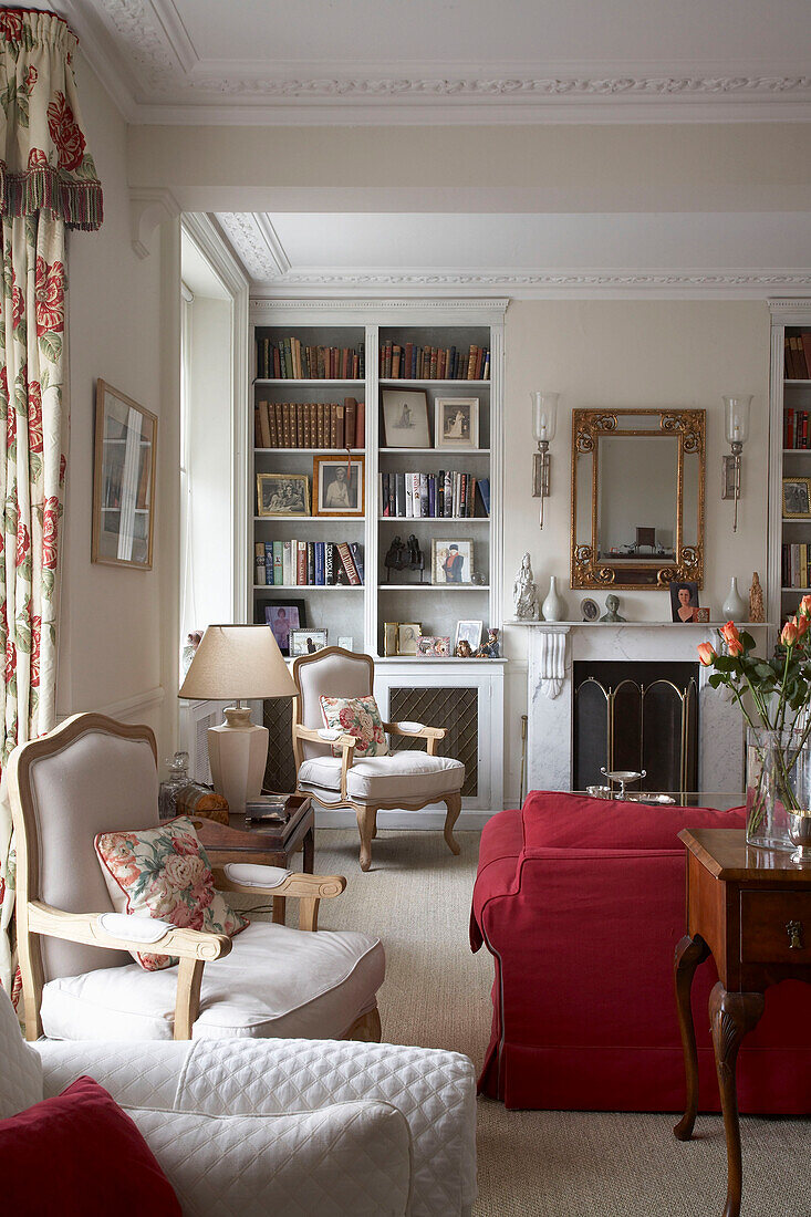 Seating area and bookcase in Arundel drawing room, West Sussex