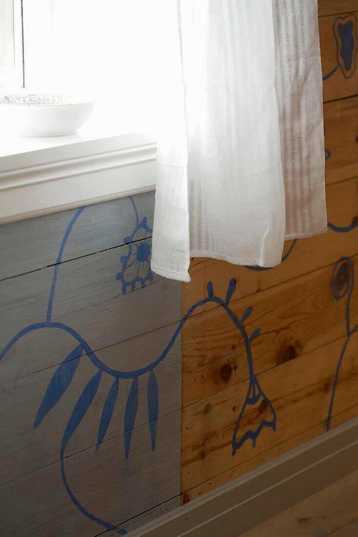 Paint effect on wooden wall below window