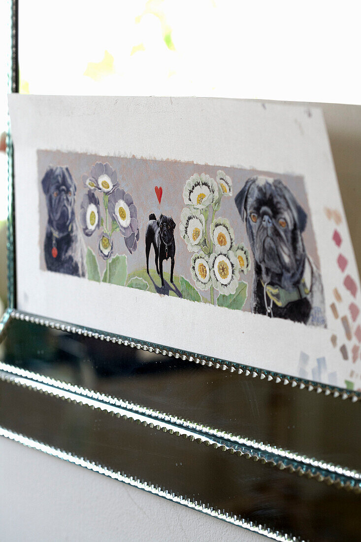 Artwork of dog in silver picture frame