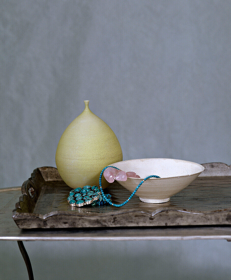 Ceramic bowl, vase and jewellery, interiors detail