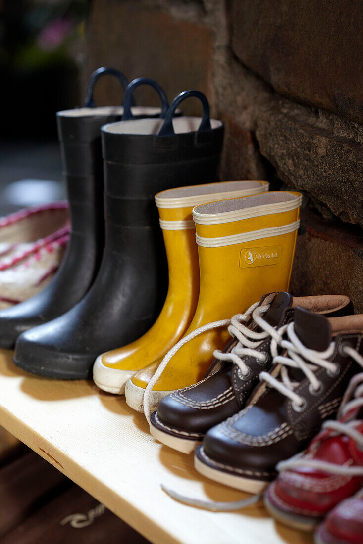 Children's footwear lined up on shelf