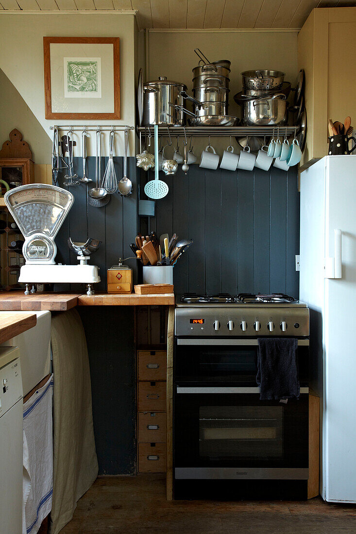 Stainless steel cooker and utensil rack in Brighton kitchen, Sussex, UK