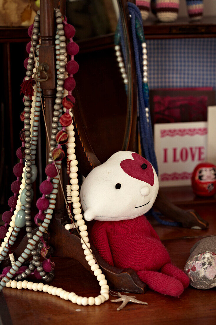 Soft toy and jewellery on dressing table in Richmond upon Thames, England, UK