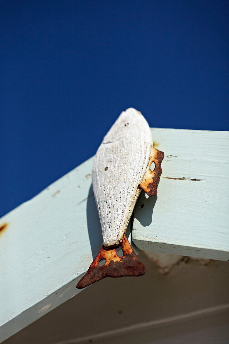Weathered fish with rusty fins and blue sky in West Sussex, England, UK
