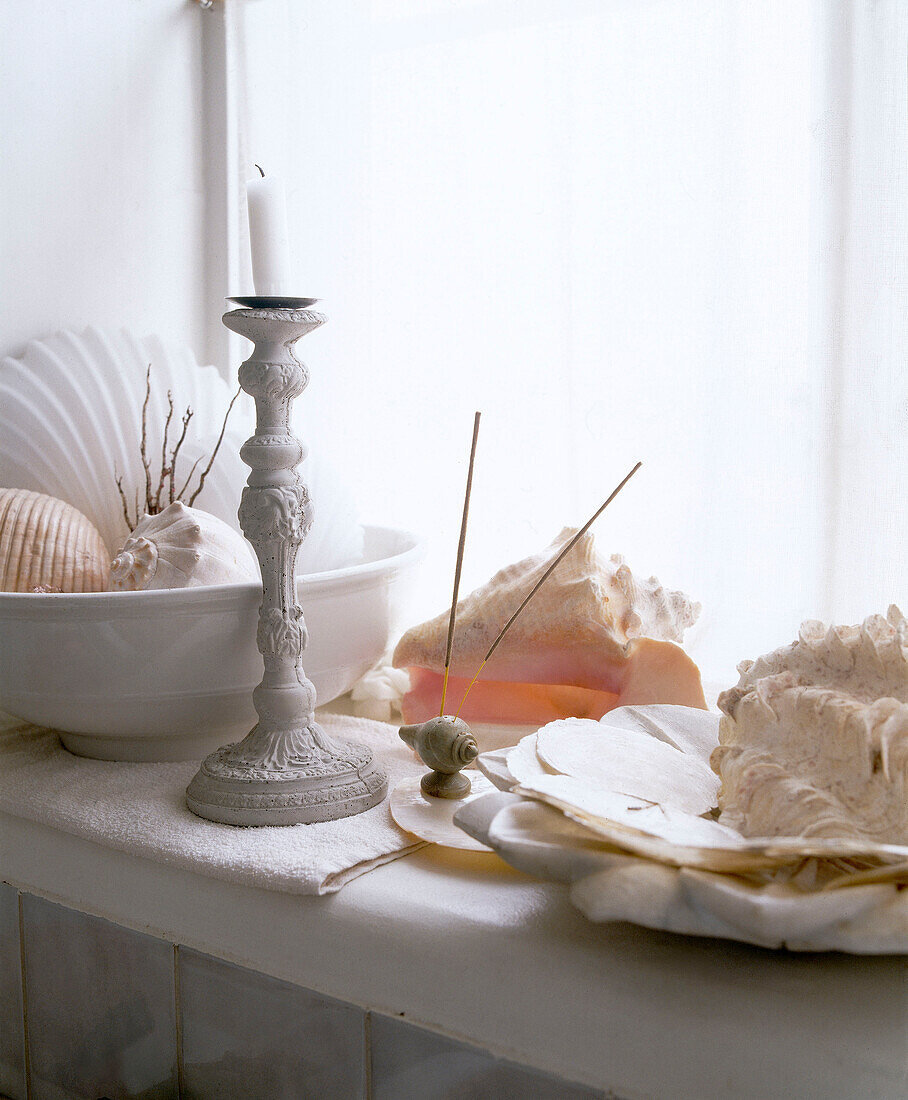 Window sill detail with candlestick and seashells