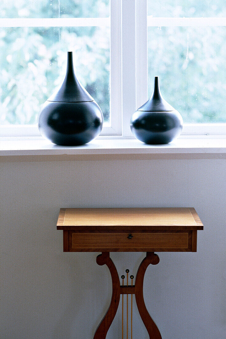 Lire table beneath window sill ceramics interiors detail period furniture