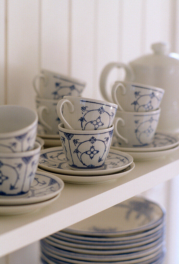 Detail of shelves with blue and white crockery