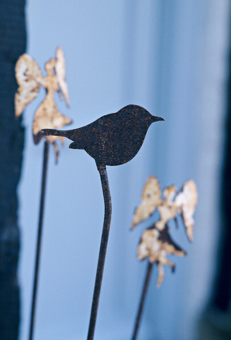 A detail of a cut out decoration of a bird figure