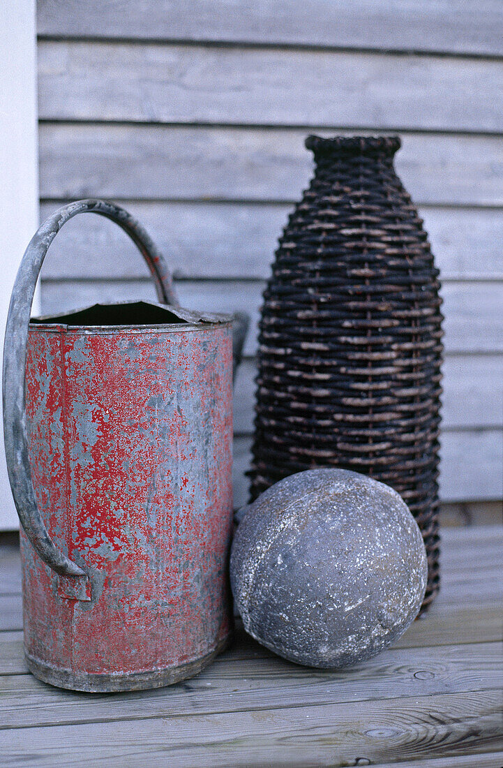 Old watering can metal ball and wicker vase