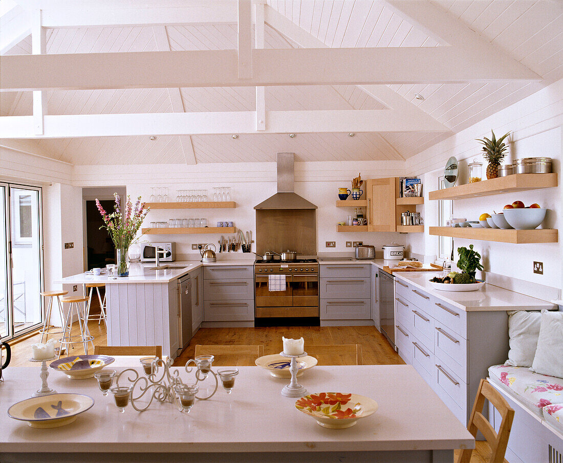 Kitchen with fitted units and breakfast bar