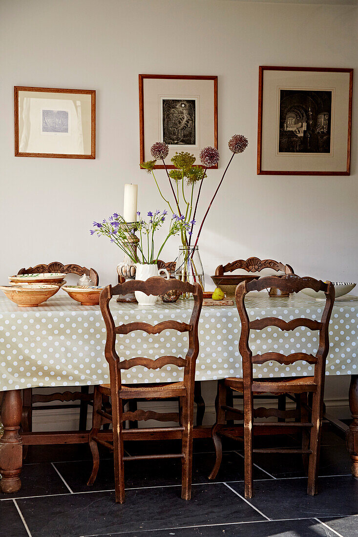 Wooden dining chairs at table in Port Issac beach house Cornwall