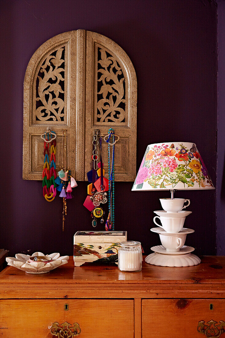 Teacup lampbase and carved wooden window shutters in Brighton home East Sussex, UK