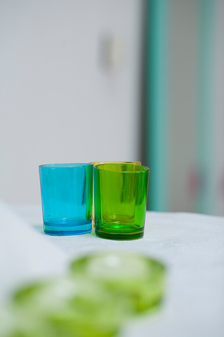 Colorful simple glass candle holders on table Buenos Aires, Argentina