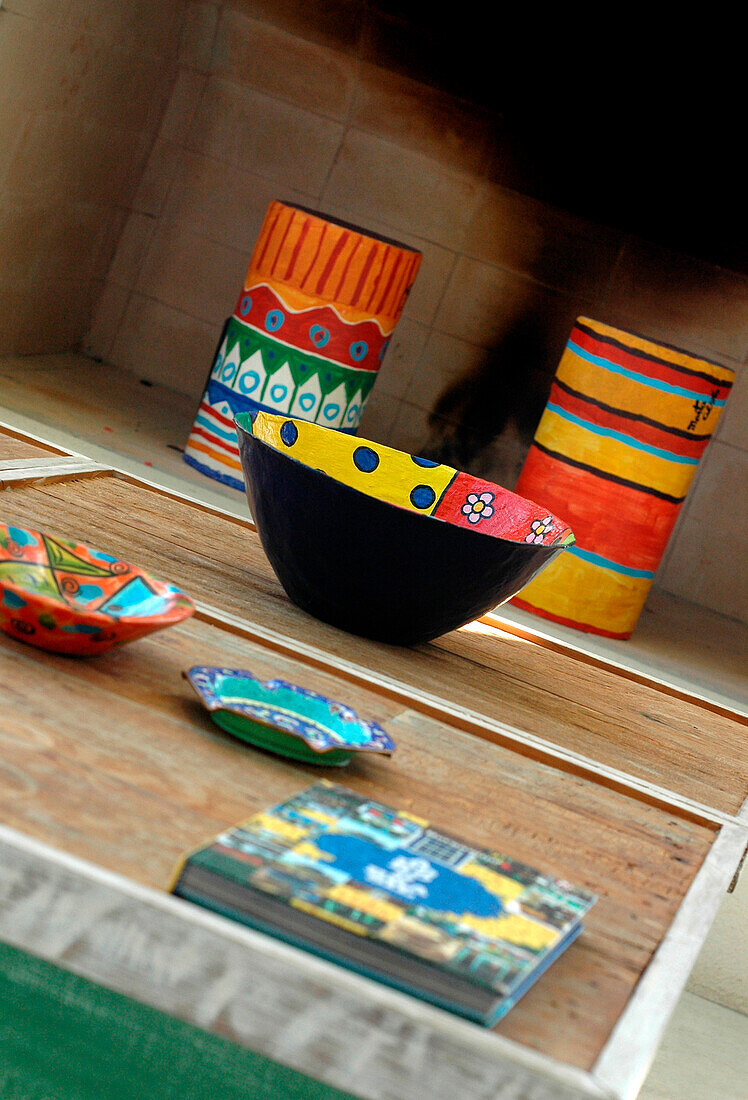 Painted wood coffee table made of 4 individual tables with ornaments giving a touch of colour
