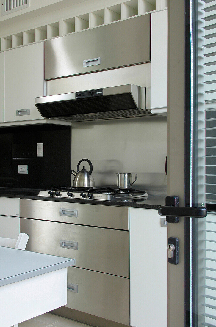 Modern style kitchen with stainless steel oven unit