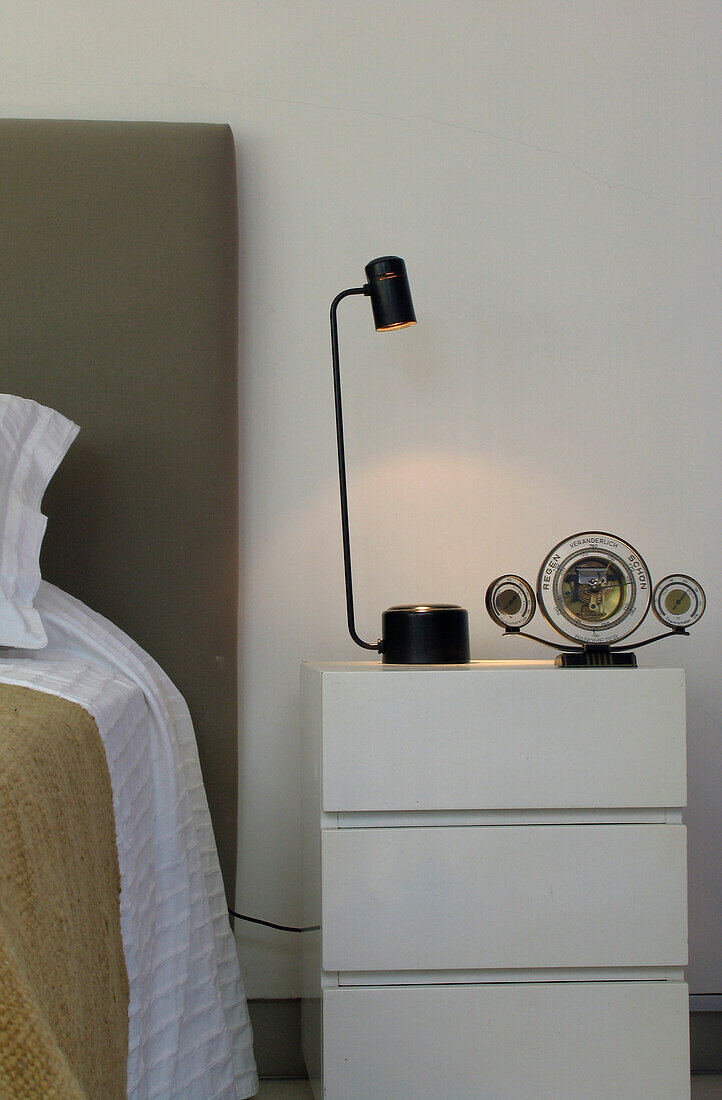 Bedside table with lamp and ornament