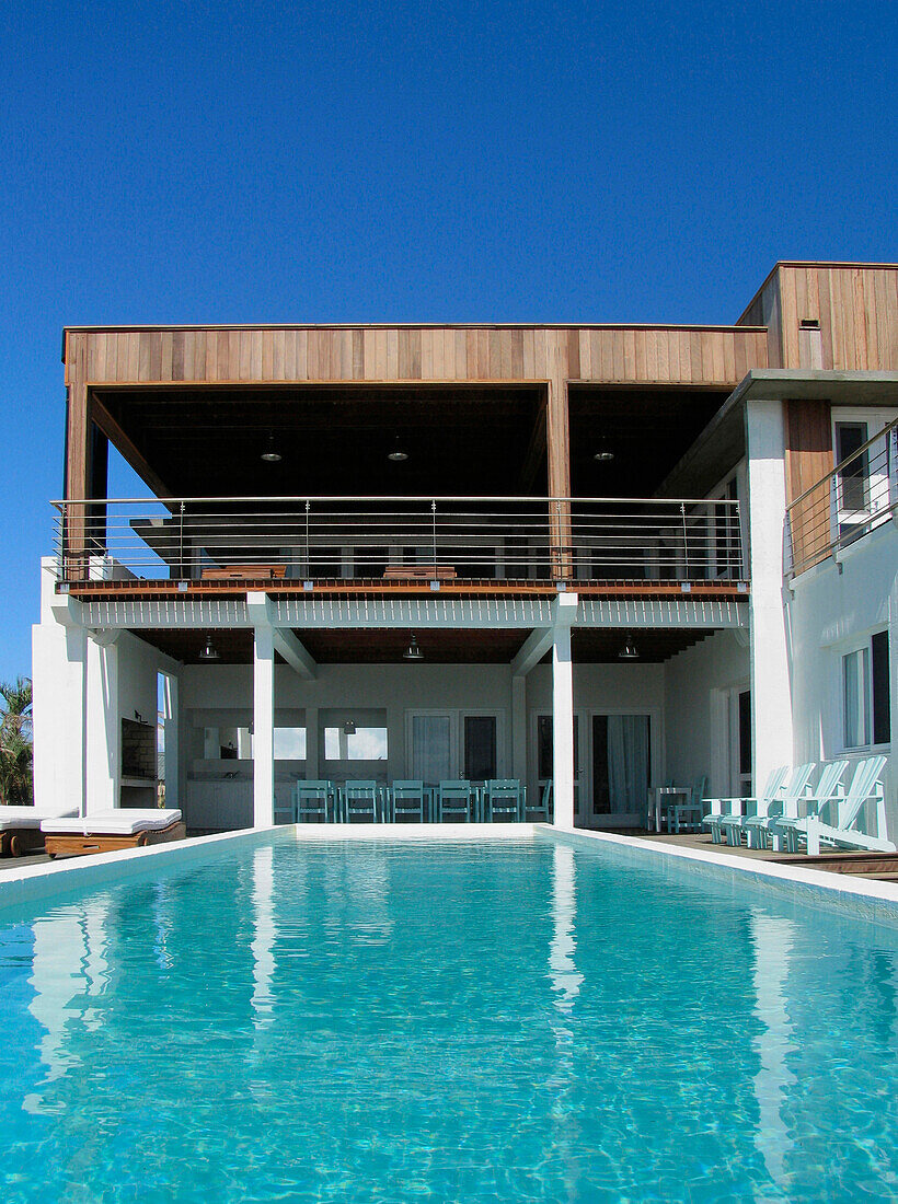 Holiday home exterior with swimming pool and balcony terrace