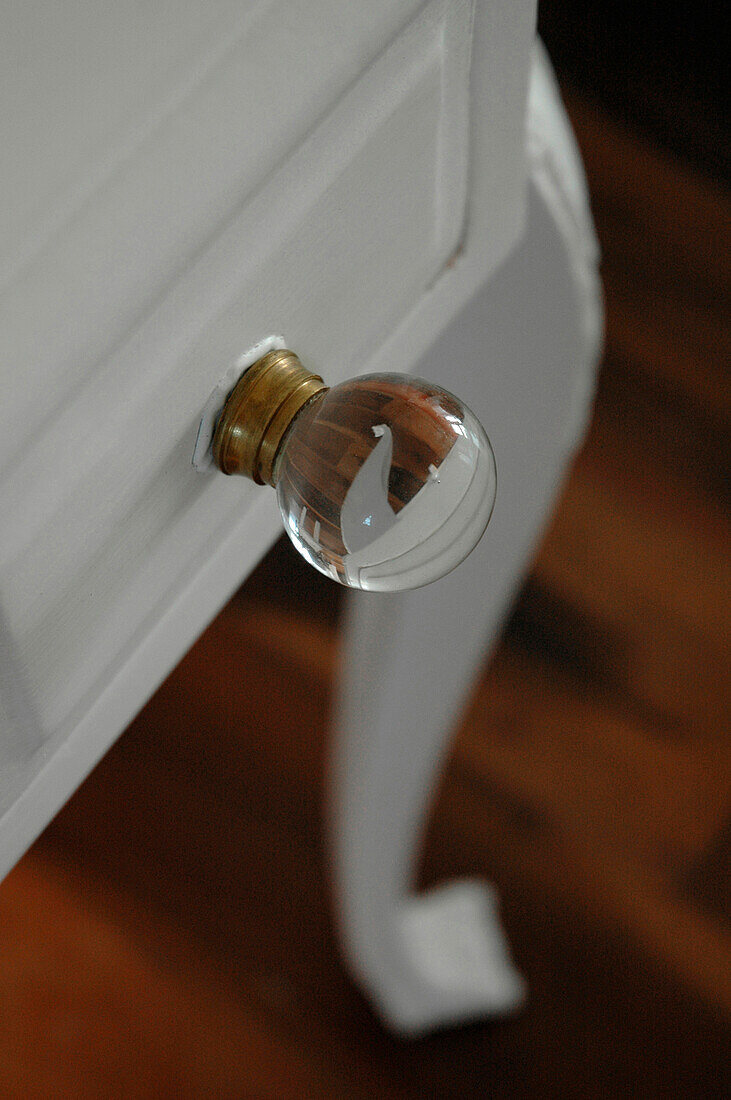 Glass handle on chest of drawers