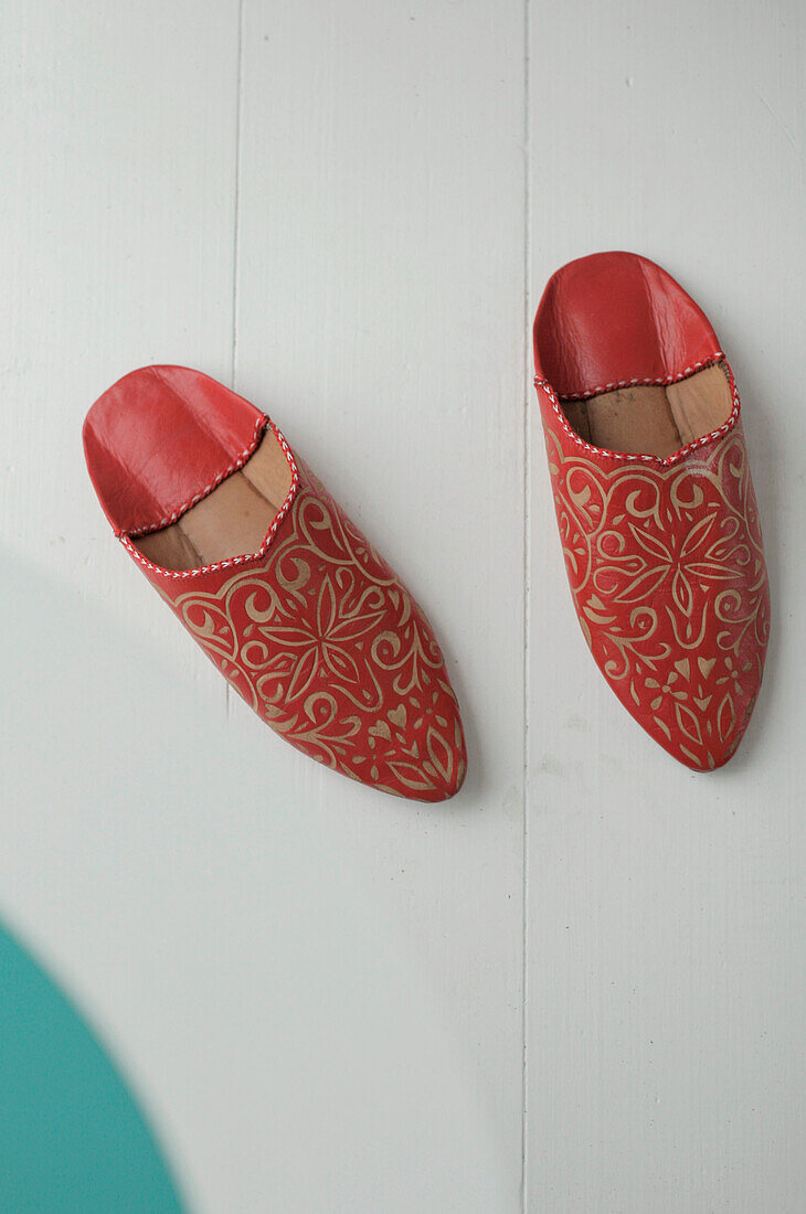 Pair of gold patterned red Indian slippers