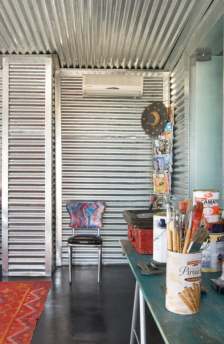 Galvanized metal room with artist's materials