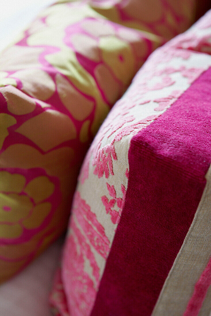 Close up of pink and green cushions