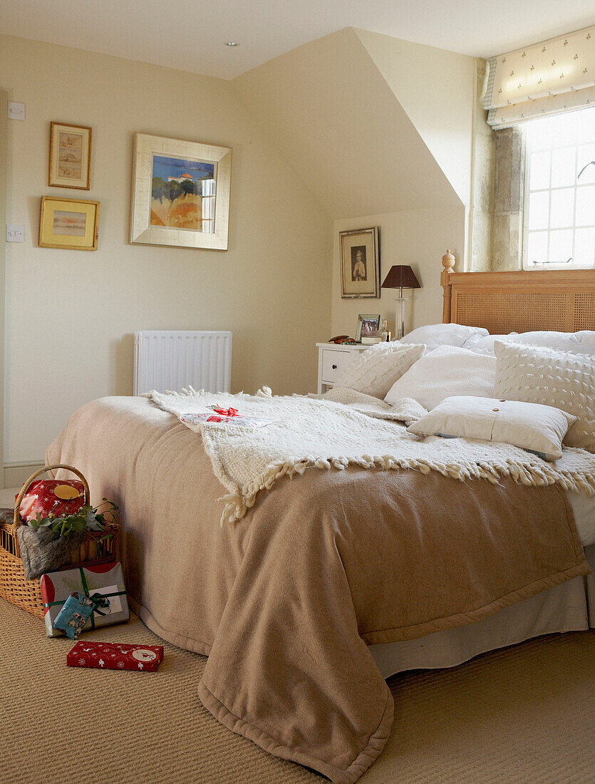 Cream bedroom with blankets under window
