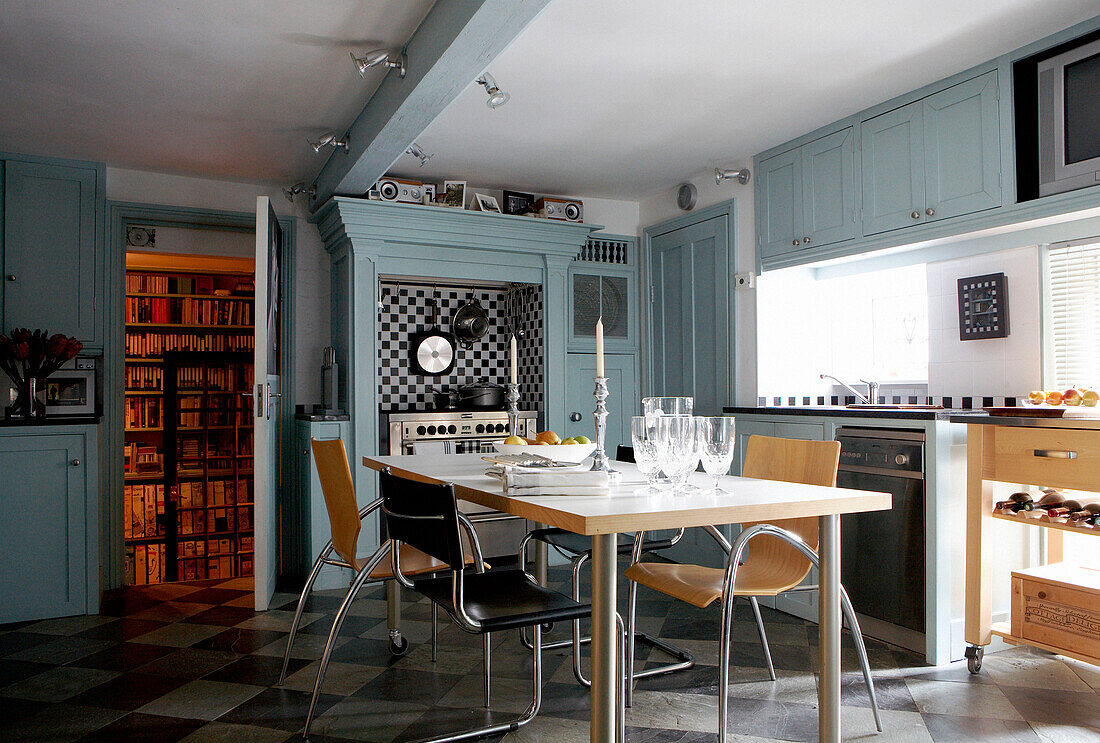 Contemporary kitchen with verdigris finish paint effect in Grade I listed Elizabethan manor house in Kent 