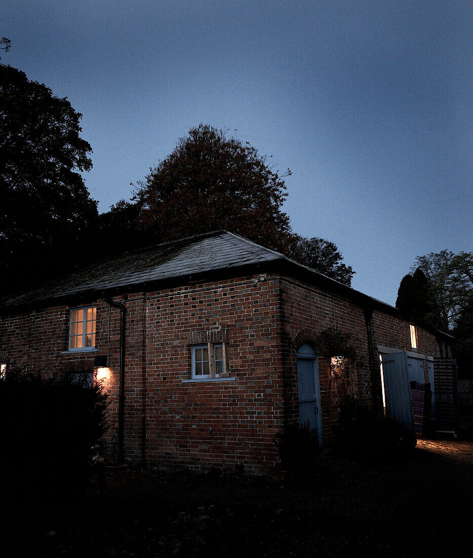 Brick country house exterior at dusk