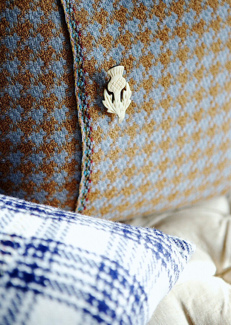 Thistle brooch on wool covered cushion
