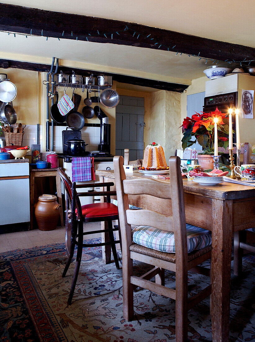 Lit candles on table of 16th Century Welsh farmhouse kitchen