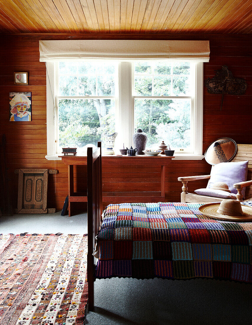 Sunlit panelled bedroom with crotchet blanket Masterton New Zealand