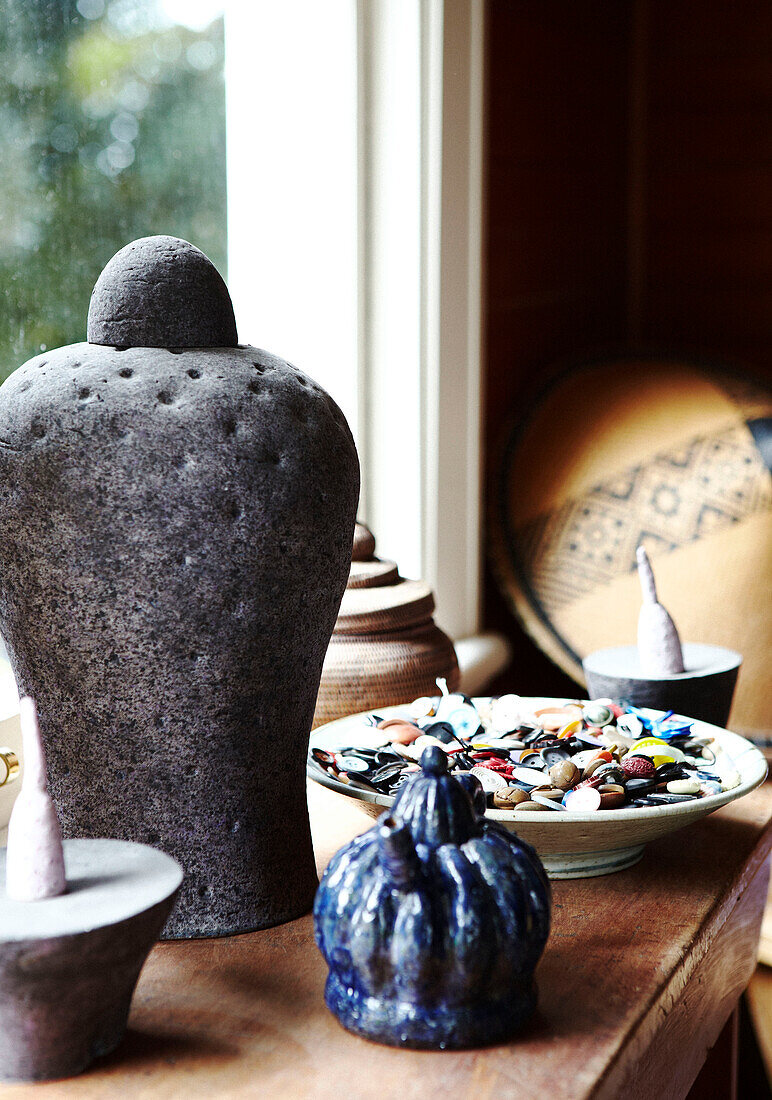 Bowl of buttons and sculptural object on windowsill Masterton New Zealand